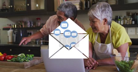 Photo for Image of envelope mail icons over senior couple using laptop at home. digital interface, social media, connection and communication concept digitally generated image. - Royalty Free Image