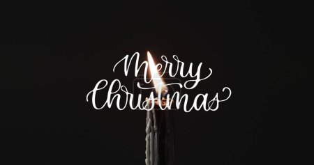 Photo for Image of merry christmas text over lit candle on black background. Christmas, tradition and celebration concept digitally generated image. - Royalty Free Image