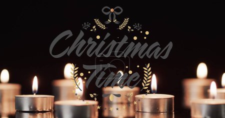 Photo for Image of merry christmas time over lit tea candles background. Christmas, tradition and celebration concept digitally generated image. - Royalty Free Image