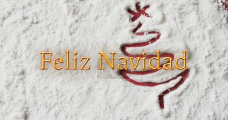 Photo for Image of feliz navidad text over christmas tree drawn in snow background. Christmas, tradition and celebration concept digitally generated image. - Royalty Free Image