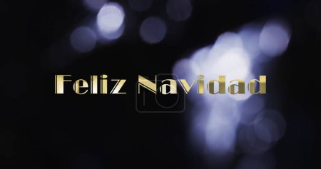 Photo for Image of feliz navidad text over purple spots of light background. Christmas, tradition and celebration concept digitally generated image. - Royalty Free Image