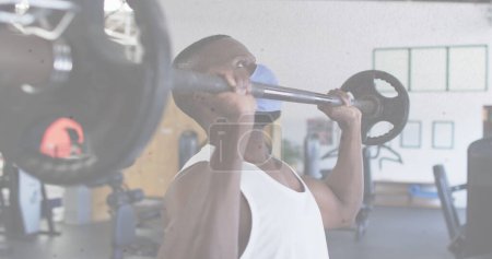 Photo for Image of african american man wearing face mask working out. global covid 19 pandemic concept - Royalty Free Image
