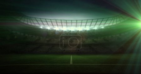 A stadium is illuminated under bright lights, with copy space. The image captures the anticipation before a major sports event at night.