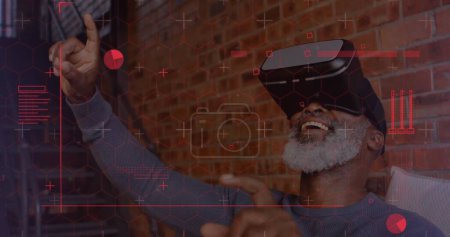 Photo for Digital interface with data processing against african american senior man wearing vr headset. computer interface and technology concept - Royalty Free Image