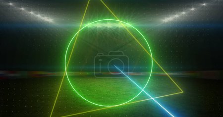 Photo for Image of rotating neon shapes and lights over floodlit sports field. sport, competition and communication technology concept, digitally generated image. - Royalty Free Image