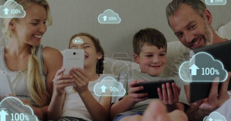 Photo for Image of digital interface with cloud icons with percent growing and arrows over family using electronic devices. Global computer network technology concept digitally generated image. - Royalty Free Image
