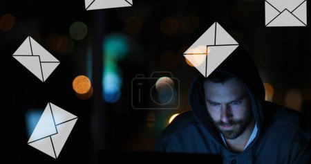Man on computer with message icons falling.