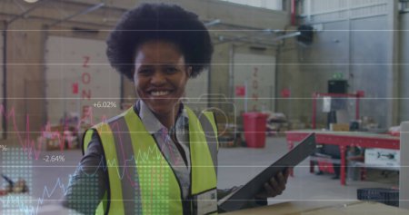 Photo for Image of statistics and data processing over african american woman working in warehouse. - Royalty Free Image
