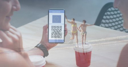 Photo for Image of woman holding smartphone with covid 19 vaccination passport over people on the beach. global covid 19 pandemic and vaccination concept digitally generated image. - Royalty Free Image