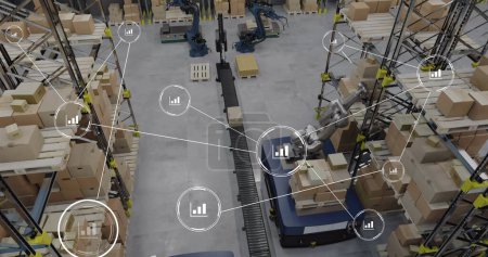 Image of network of conncetions with icons over robotic arms with boxes warehouse. Global conncetions, innovation, delivery and shipping concept digitally generated image.