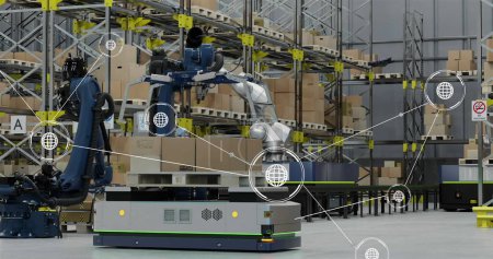 Image of network of conncetions with icons over robotic arms with boxes in warehouse. Global conncetions, innovation, delivery and shipping concept digitally generated image.
