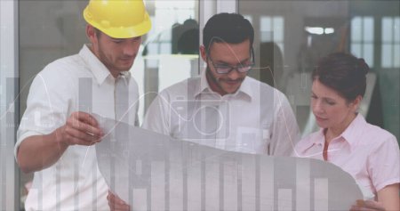 Photo for Three architects discuss with a building plan in office. - Royalty Free Image