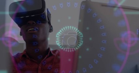 Neon scope scanner against african american man wearing vr headset at office. computer interface and technology concept