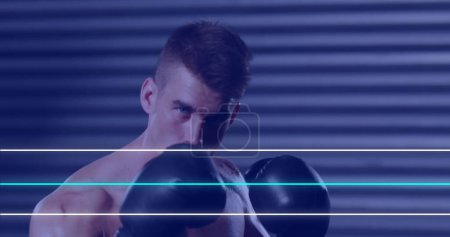 Téléchargez les photos : Image de lignes néons bleues et blanches au-dessus du boxeur masculin caucasien s'échauffant. sport, fitness et concept de compétition, image digitale. - en image libre de droit