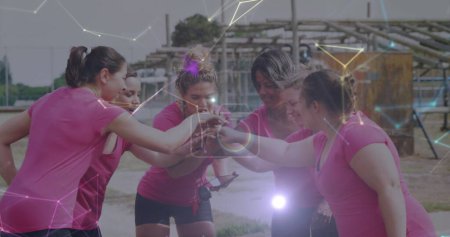 Image of shapes over diverse women at obstacle course teaming up. Global sport, health, fitness and digital interface concept digitally generated image.