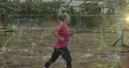 Image of shapes over diverse women at obstacle course running. Global sport, health, fitness and digital interface concept digitally generated image.