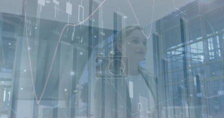 Image of statistics processing over businesswoman. global business, data processing and digital interface concept digitally generated image.