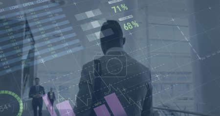 Image of statistics processing over businessman. global business, data processing and digital interface concept digitally generated image.