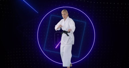 Image of purple neon scanner processing data over female martial artist. sport, competition and technology concept, digitally generated image.
