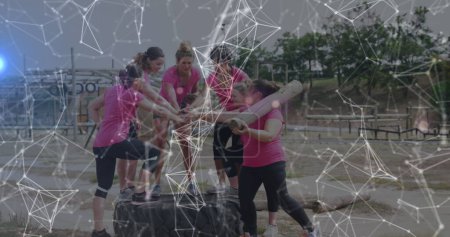 Photo for Image of shapes over diverse women at obstacle course teaming up. Global sport, health, fitness and digital interface concept digitally generated image. - Royalty Free Image