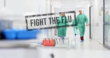 Photo for Image of fight the flue text and syringe over diverse surgeons in hospital. Global medicine, healthcare, connections, computing and data processing concept digitally generated image. - Royalty Free Image