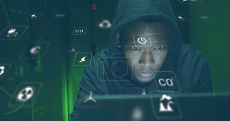 Photo for Image of falling icons over african american hacker. Cloud computing concept concept digitally generated image. - Royalty Free Image