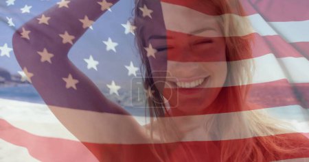 Photo for Image of flag of usa over caucasian woman on beach in summer. Usa, american patriotism, national flag and lifestyle concept digitally generated image. - Royalty Free Image