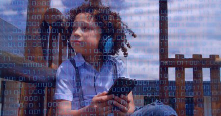 Photo for Image of data processing over biracial boy using smartphone. Global business, finances and digital interface concept digitally generated image. - Royalty Free Image