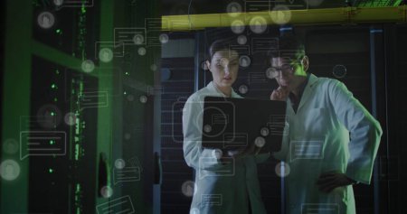 Image of data processing over diverse couple of server room workers. Cloud computing concept concept digitally generated image.