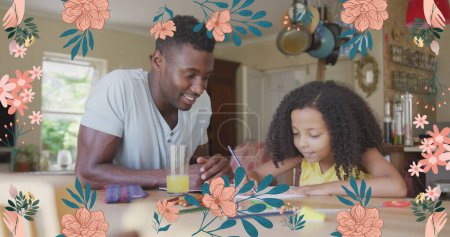 Image of flowers over african american father doing homework with his daughter. family life, childhood, love and care concept digitally generated image.