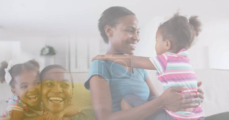 Photo for Composite of happy african american mother and daughter, embracing and hugging at home. family, childhood and wellbeing concept digitally generated image. - Royalty Free Image
