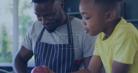 Téléchargez les photos : Image de lumières sur heureux père afro-américain et fils cuisinant ensemble. famille, convivialité, passer du temps de qualité concept image générée numériquement. - en image libre de droit
