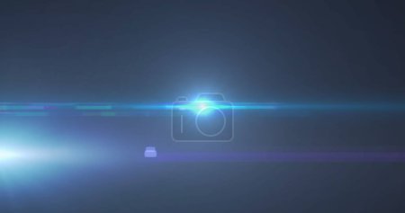Photo for Image of blue spotlight with lens flare and light beams moving over dark background. movement, energy and light, abstract interface background concept digitally generated image. - Royalty Free Image