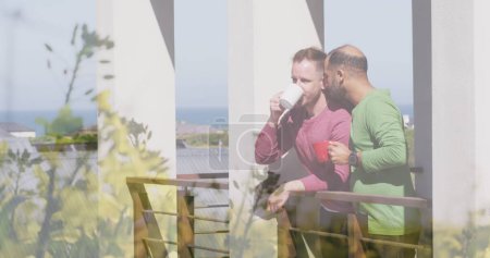 Photo for Image of plants over diverse male couple drinking coffee and embracing. Valentine's day, love and celebration concept digitally generated image. - Royalty Free Image