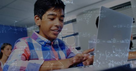 Photo for Image of mathematical equations over schoolboy using laptop in classroom. education, learning and technology concept digitally generated image. - Royalty Free Image