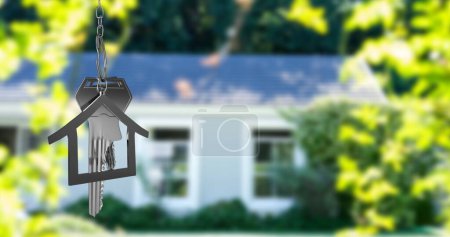 Image of silver house keys and house shaped key fob hanging over an out of focus house 4k