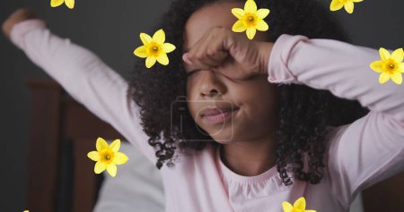 Photo for Image of flowers over african american girl waking up. family life and childhood concept digitally generated image. - Royalty Free Image
