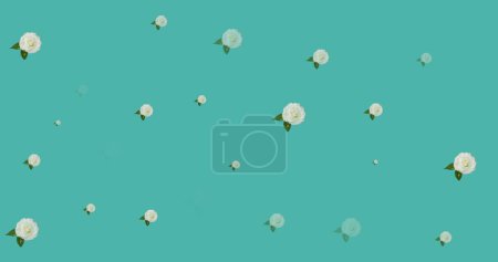 Image of flowers moving in hypnotic motion on blue background. colour, nature, pattern and movement concept digitally generated image.