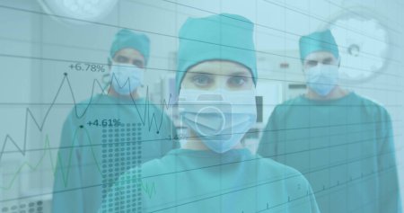 Financial data processing against portrait of team of surgeons wearing face masks. global finance and medical science concept