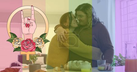 Photo for Image of rainbow flag and hand with roses over lesbian couple embracing at home. lgbt rights and equality concept digitally generated image. - Royalty Free Image