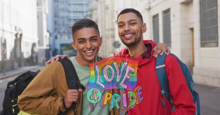 Photo for Image of love and pride over gay couple embracing on street. lgbt rights and equality concept digitally generated image. - Royalty Free Image