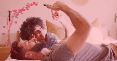 Photo for Image of hearts ove diverse couple using smartphone. Relationship, love, romance and lifestyle concept digitally generated image. - Royalty Free Image