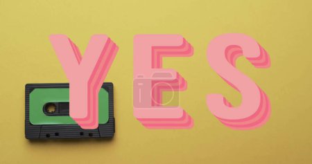 Photo for Image of yes text over tape on yellow background. Technology, retro and music concept, digitally generated image. - Royalty Free Image