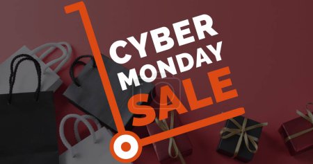 Photo for Image of cyber monday sale text over gifts and bags. Sales, retail, cyber shopping, digital interface, communication, computing and data processing concept digitally generated image. - Royalty Free Image