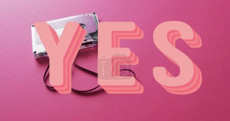 Photo for Image of yes text over tape on pink background. Technology, retro and music concept, digitally generated image. - Royalty Free Image