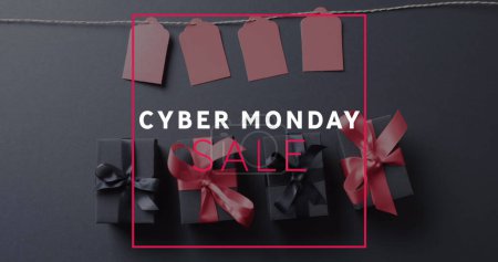 Photo for Image of cyber monday sale text over gift tags and boxes on black background. Cyber monday, online shopping, shipping and global connections concept digitally generated image. - Royalty Free Image