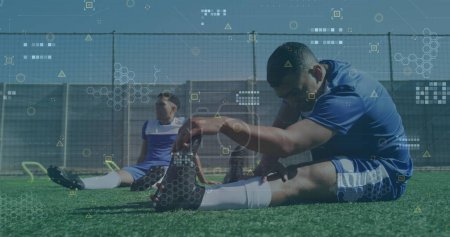 Photo for Image of data processing over diverse football players on pitch. Sports, competition and data processing concept digitally generated image. - Royalty Free Image