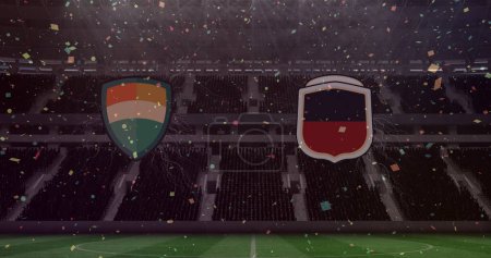 Téléchargez les photos : Confettis colorés tombant sur deux insignes d'équipes contre le stade de sport en arrière-plan. compétition sportive et concept de tournoi - en image libre de droit