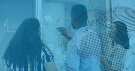 Photo for Image of financial data processing and globe over diverse business people in office. Global business and digital interface concept digitally generated image. - Royalty Free Image