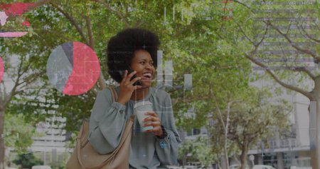 Photo for Image of business data over african american woman using smartphone. Global business, connections and data processing concept digitally generated image. - Royalty Free Image